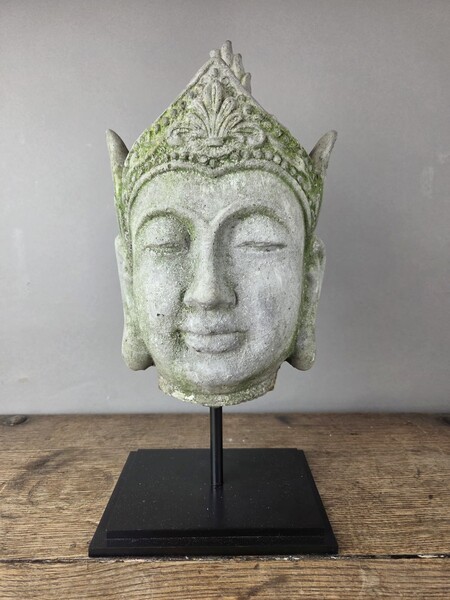 Reconstituted stone Buddha head, mounted on a base, early 20th century 