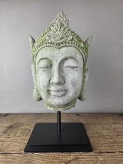 Reconstituted stone Buddha head, mounted on a base, early 20th century 