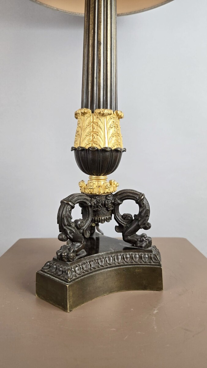 Restoration period lamp base in bronze with a black and gold patina