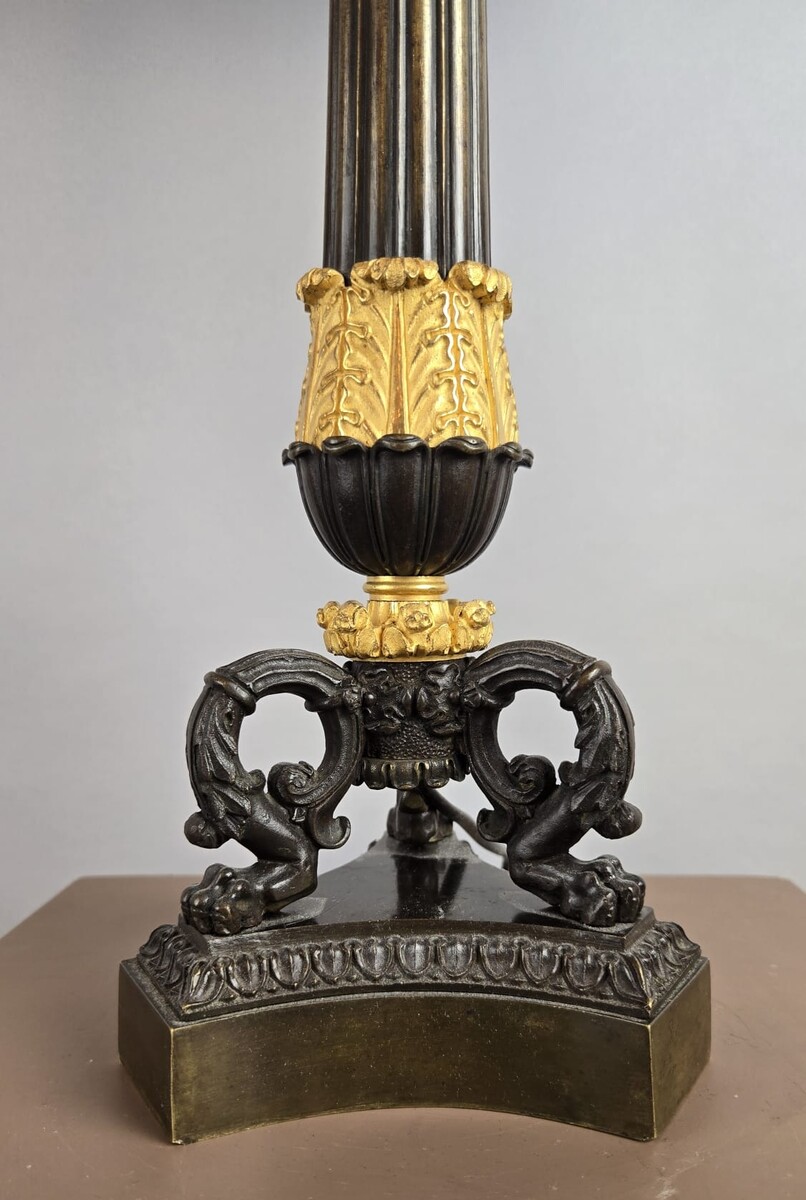 Restoration period lamp base in bronze with a black and gold patina
