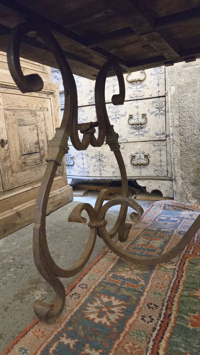 Riveted wrought iron table with teak top
