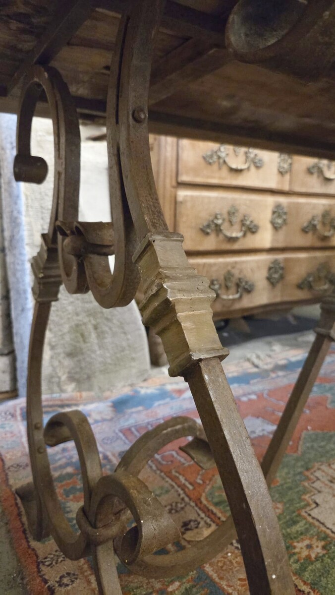Riveted wrought iron table with teak top