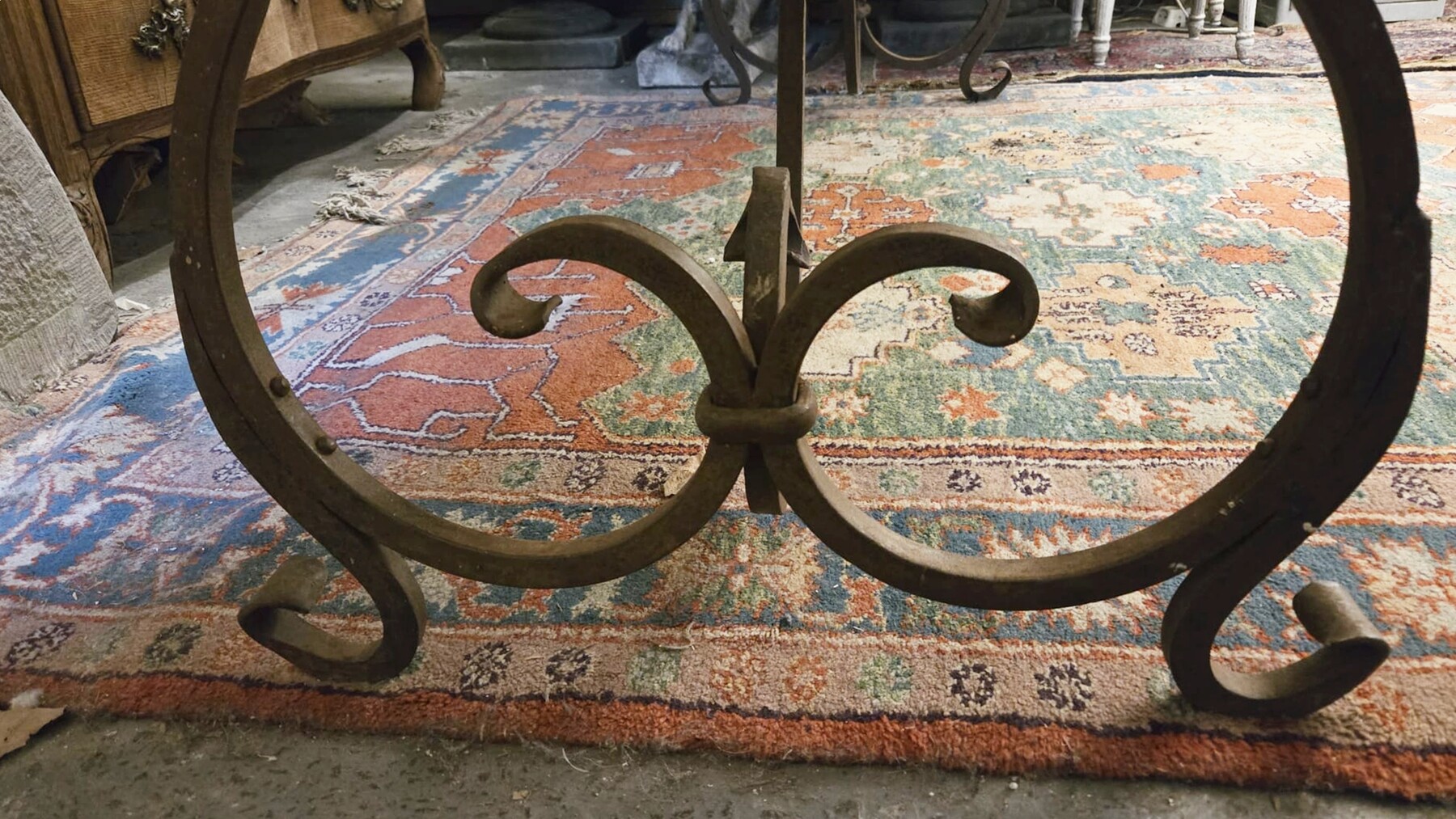 Riveted wrought iron table with teak top