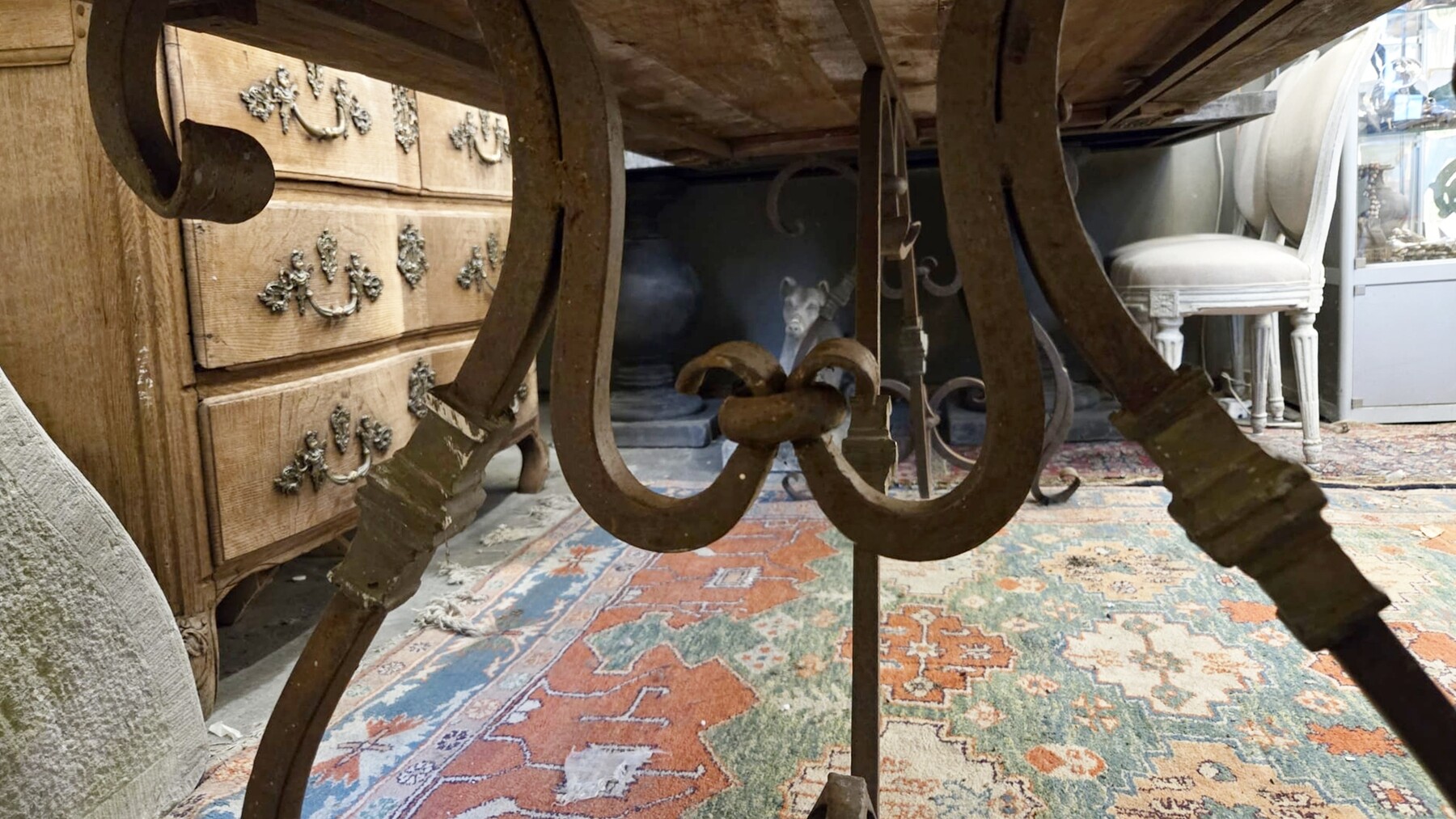 Riveted wrought iron table with teak top