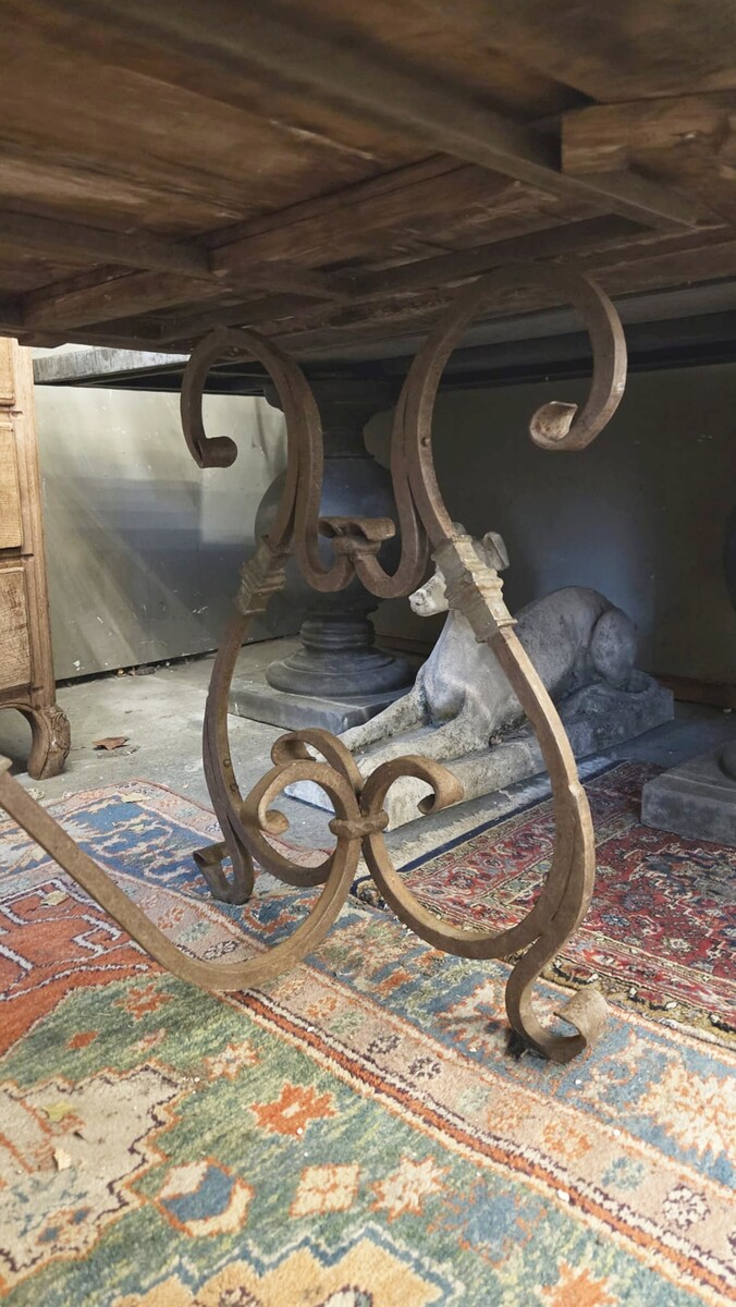 Riveted wrought iron table with teak top