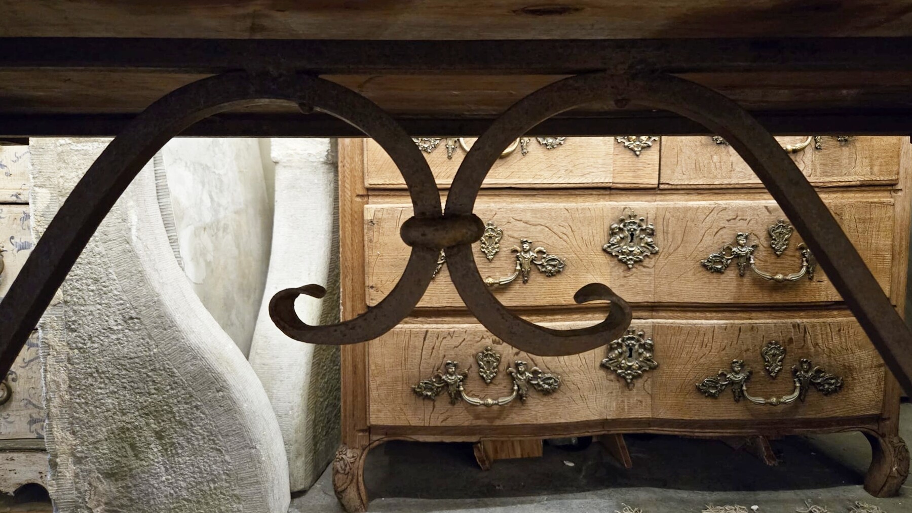 Riveted wrought iron table with teak top