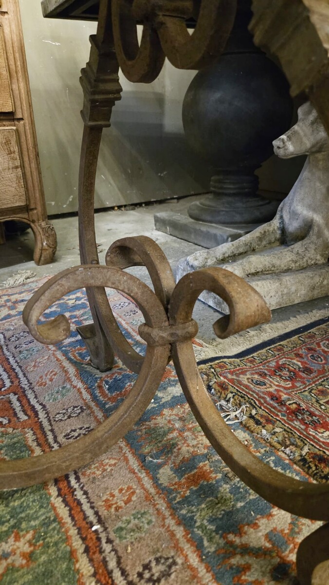 Riveted wrought iron table with teak top