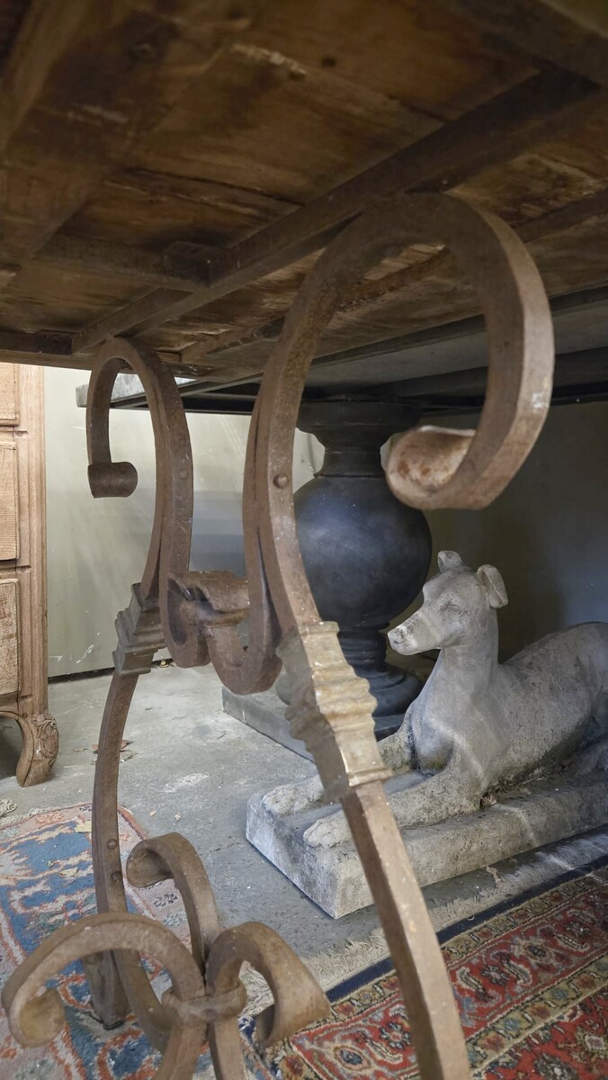 Riveted wrought iron table with teak top