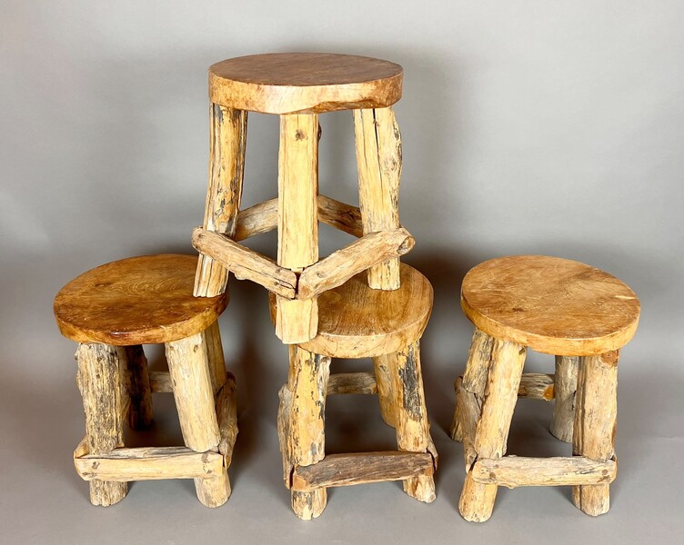 Set of four brutalist wooden stools