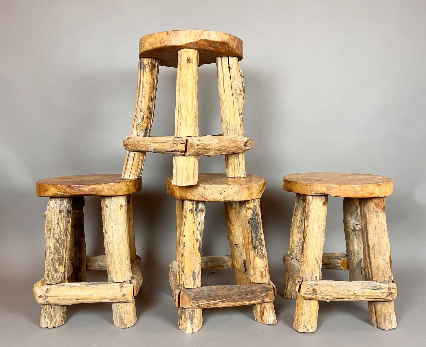 Set of four brutalist wooden stools