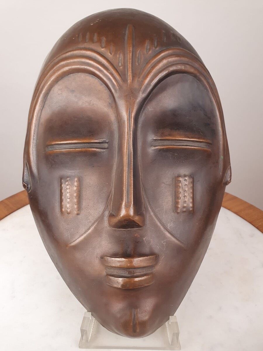 Signed embossed copper mask