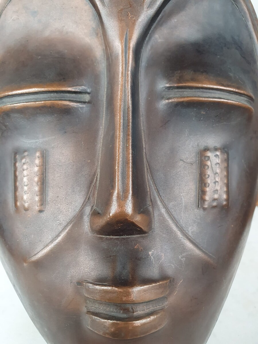 Signed embossed copper mask
