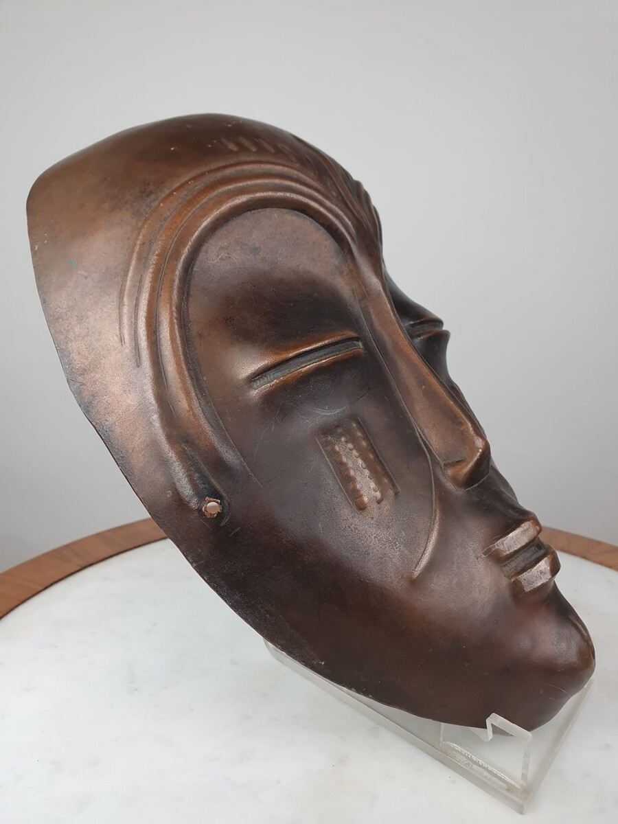 Signed embossed copper mask