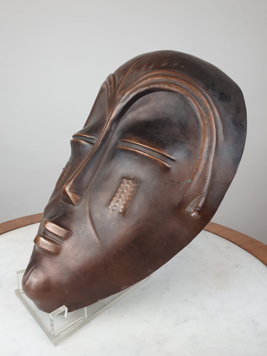 Signed embossed copper mask