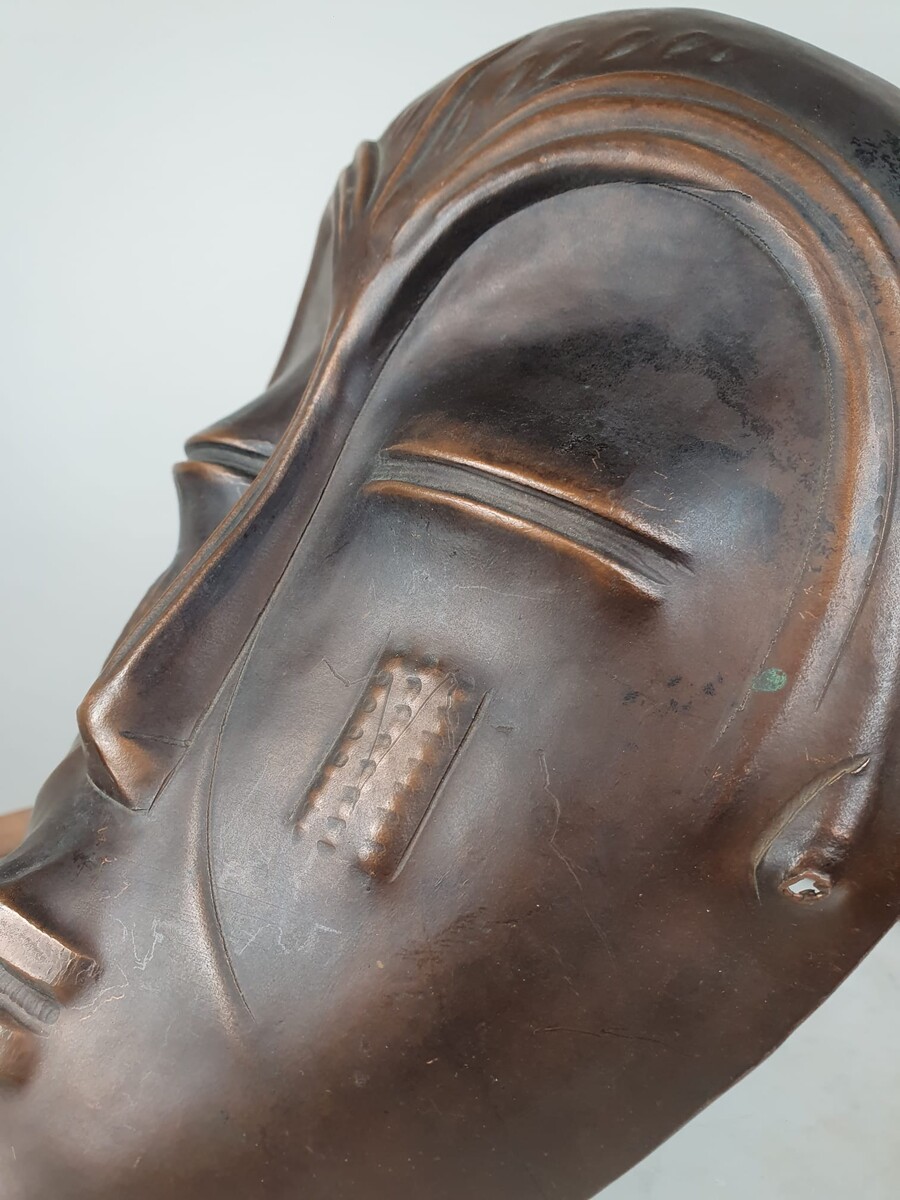 Signed embossed copper mask