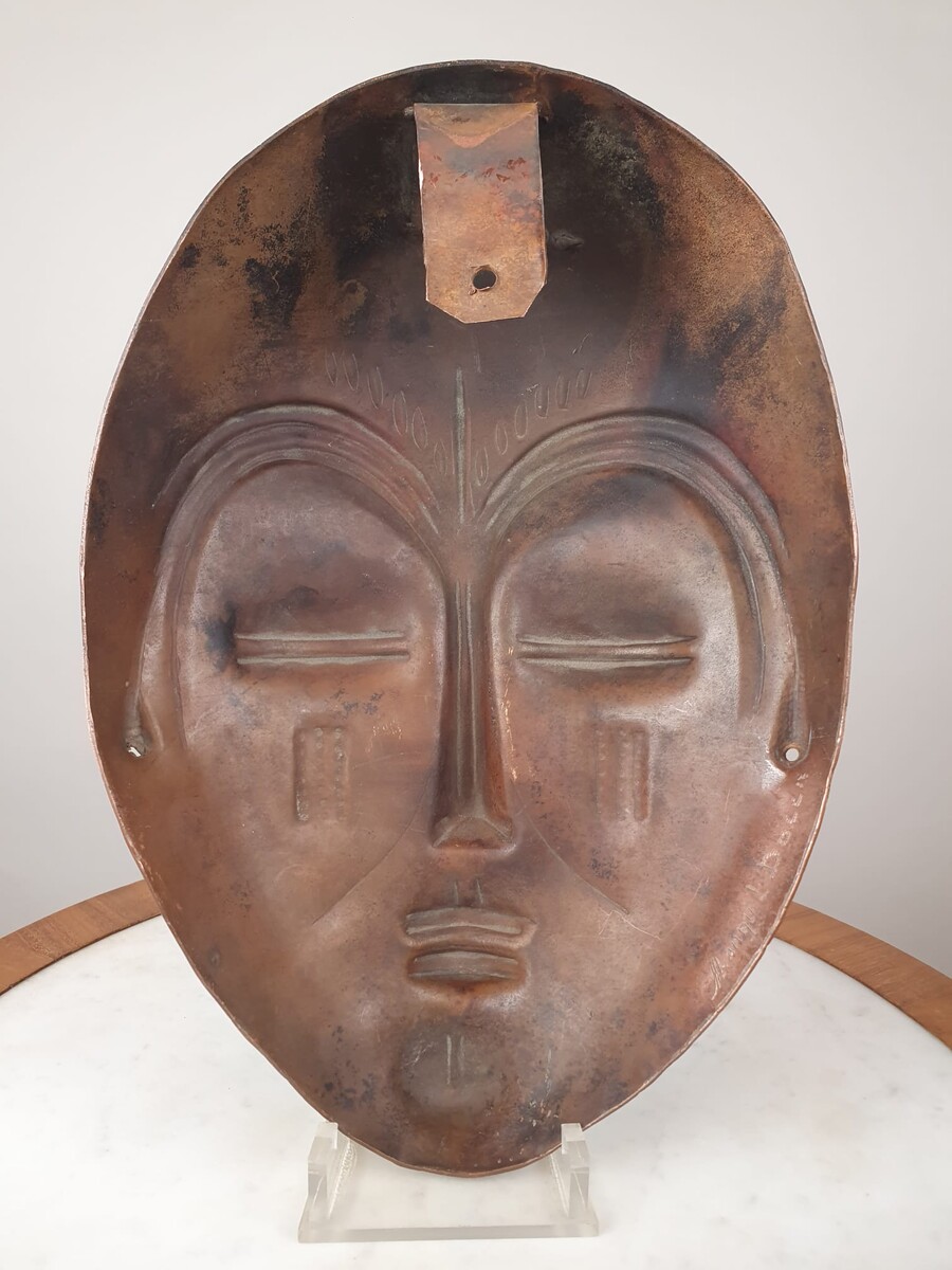 Signed embossed copper mask