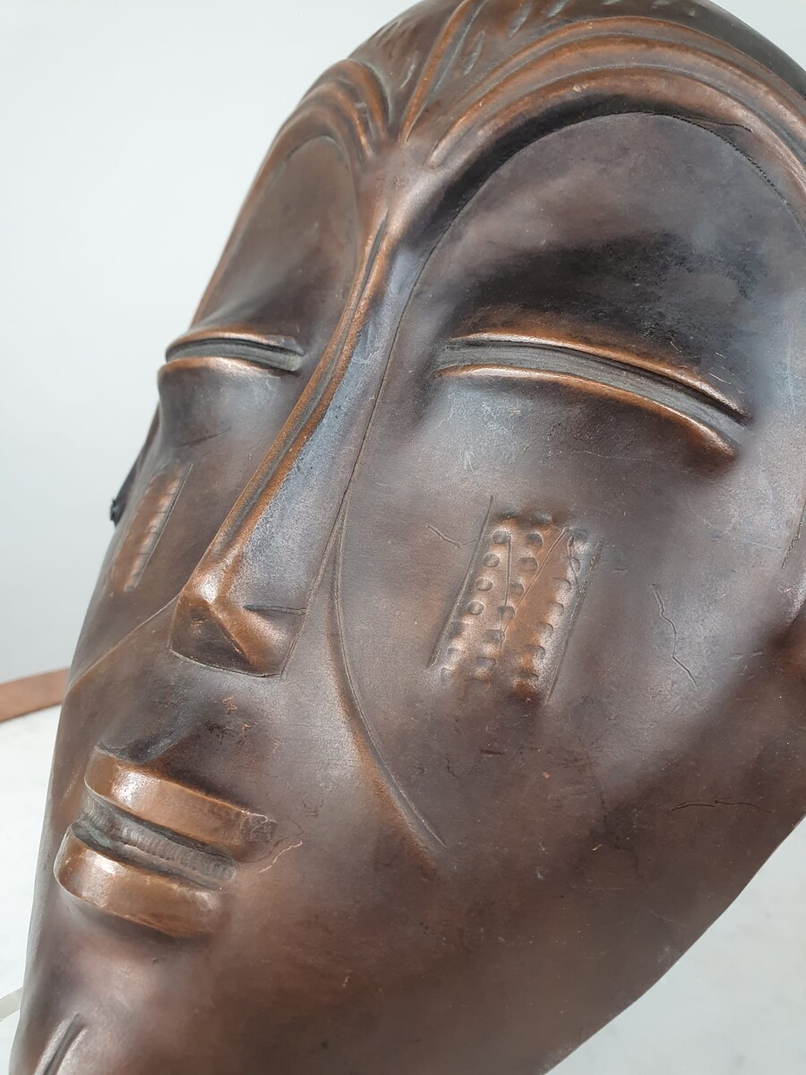 Signed embossed copper mask