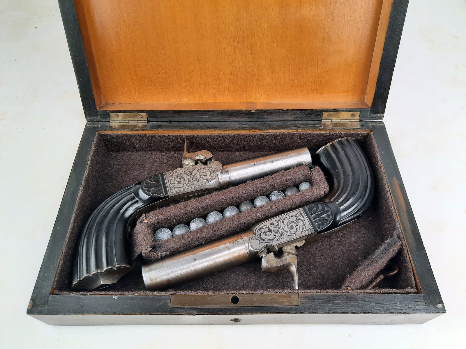 Small box, pair of percussion chest pistols