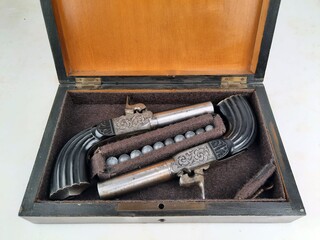 Small box, pair of percussion chest pistols