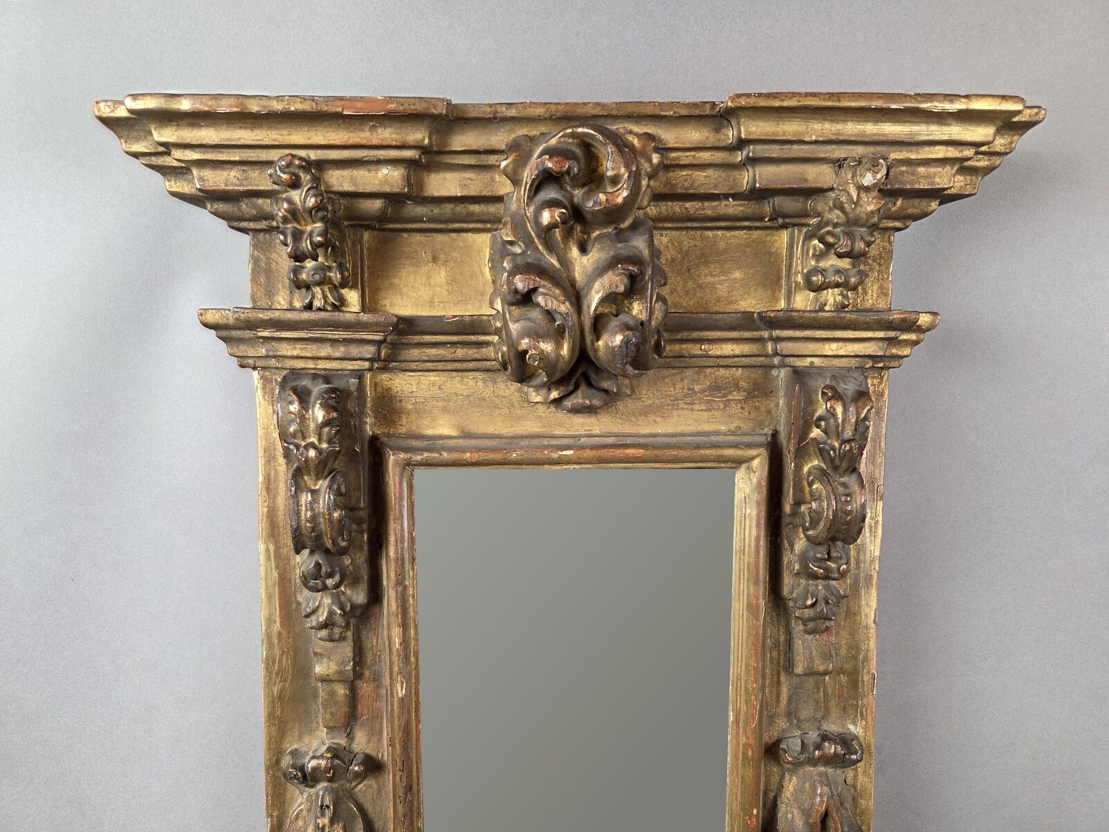 Small gilded wooden mirror between two mirrors, 18th century