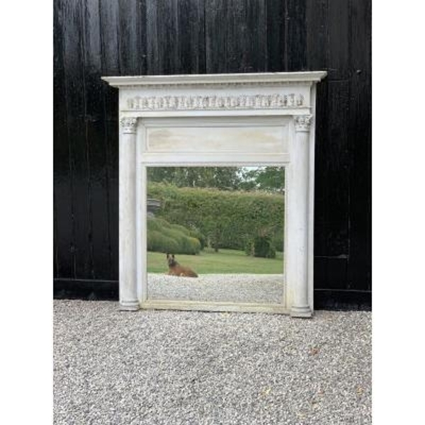 Stucco and wooden fireplace mirror