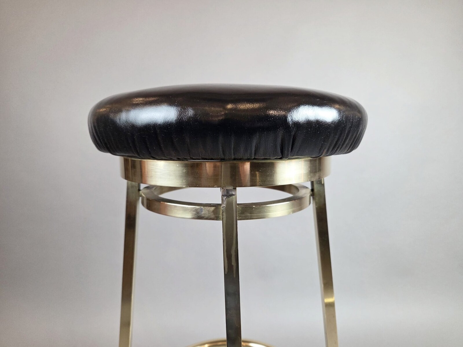 Suite of 3 brass barstools with leather seats, circa 1940