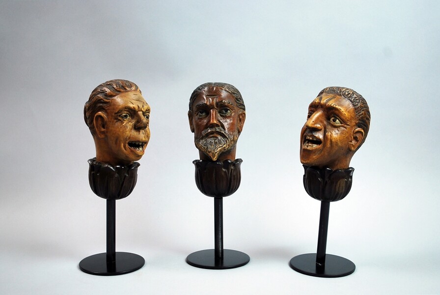 Three grotesque puppets heads