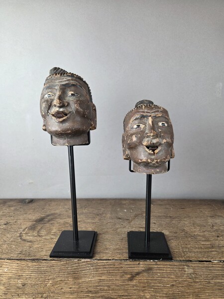 Two carved wooden puppet heads on a base, Burma, late 19th century