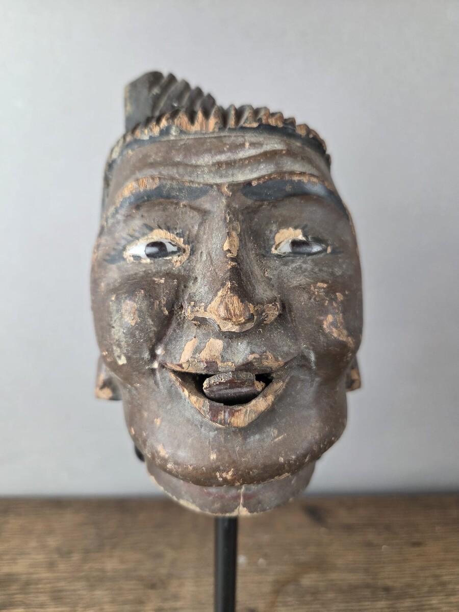 Two carved wooden puppet heads on a base, Burma, late 19th century