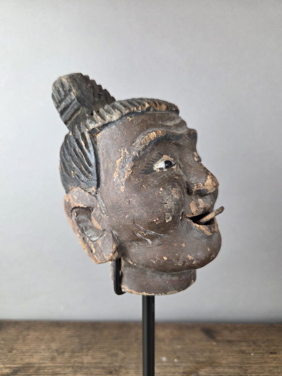 Two carved wooden puppet heads on a base, Burma, late 19th century