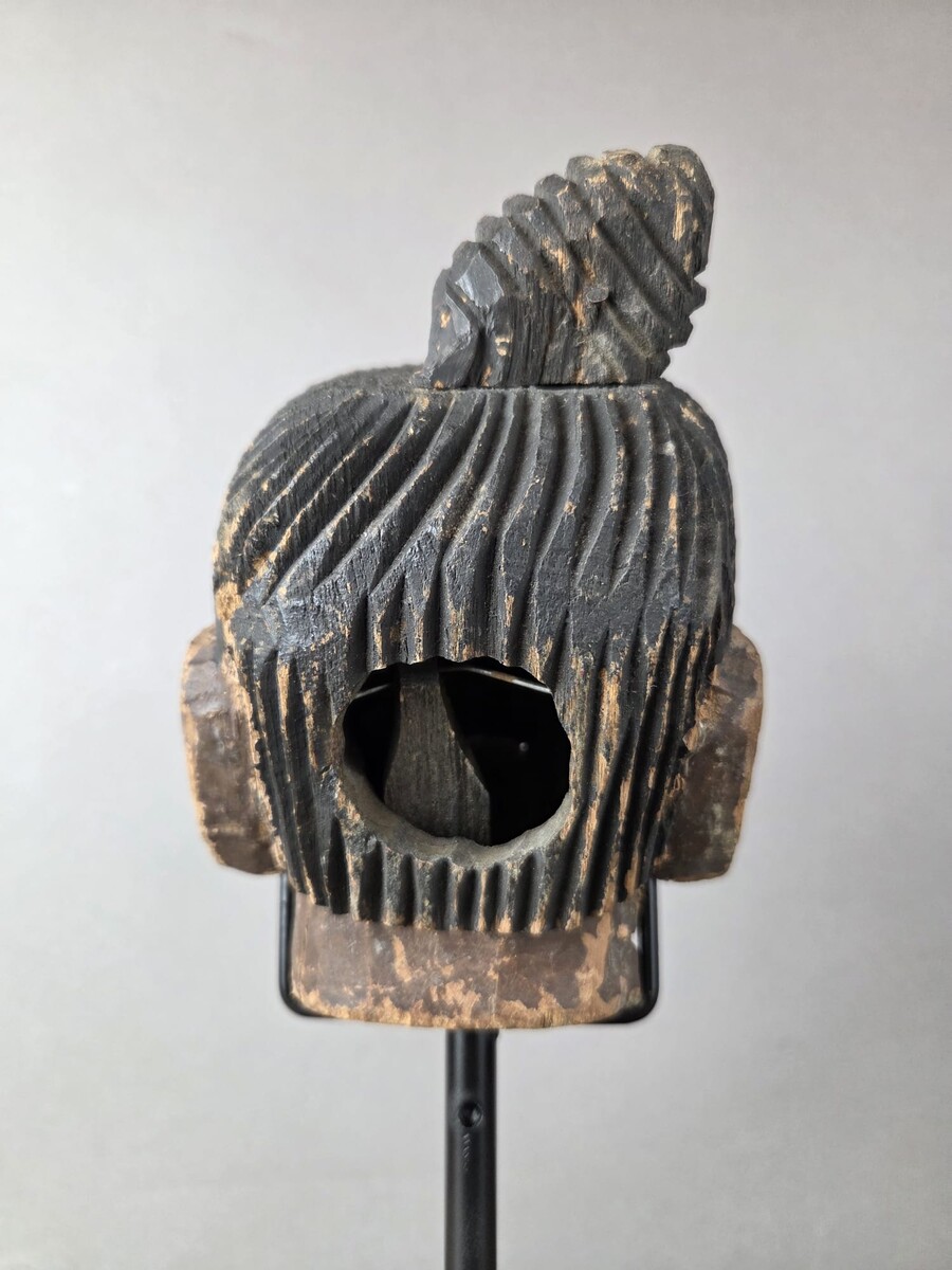 Two carved wooden puppet heads on a base, Burma, late 19th century