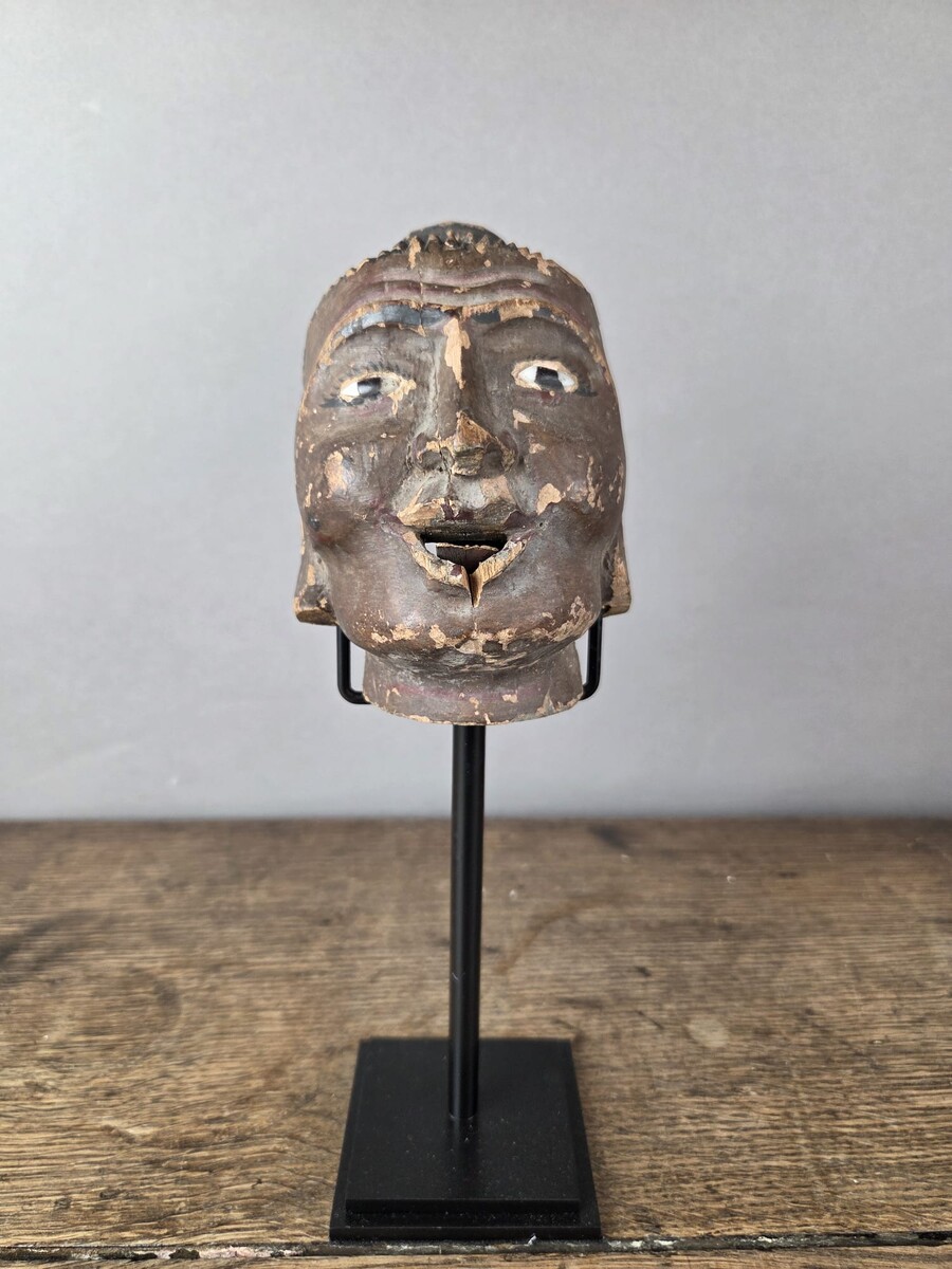 Two carved wooden puppet heads on a base, Burma, late 19th century