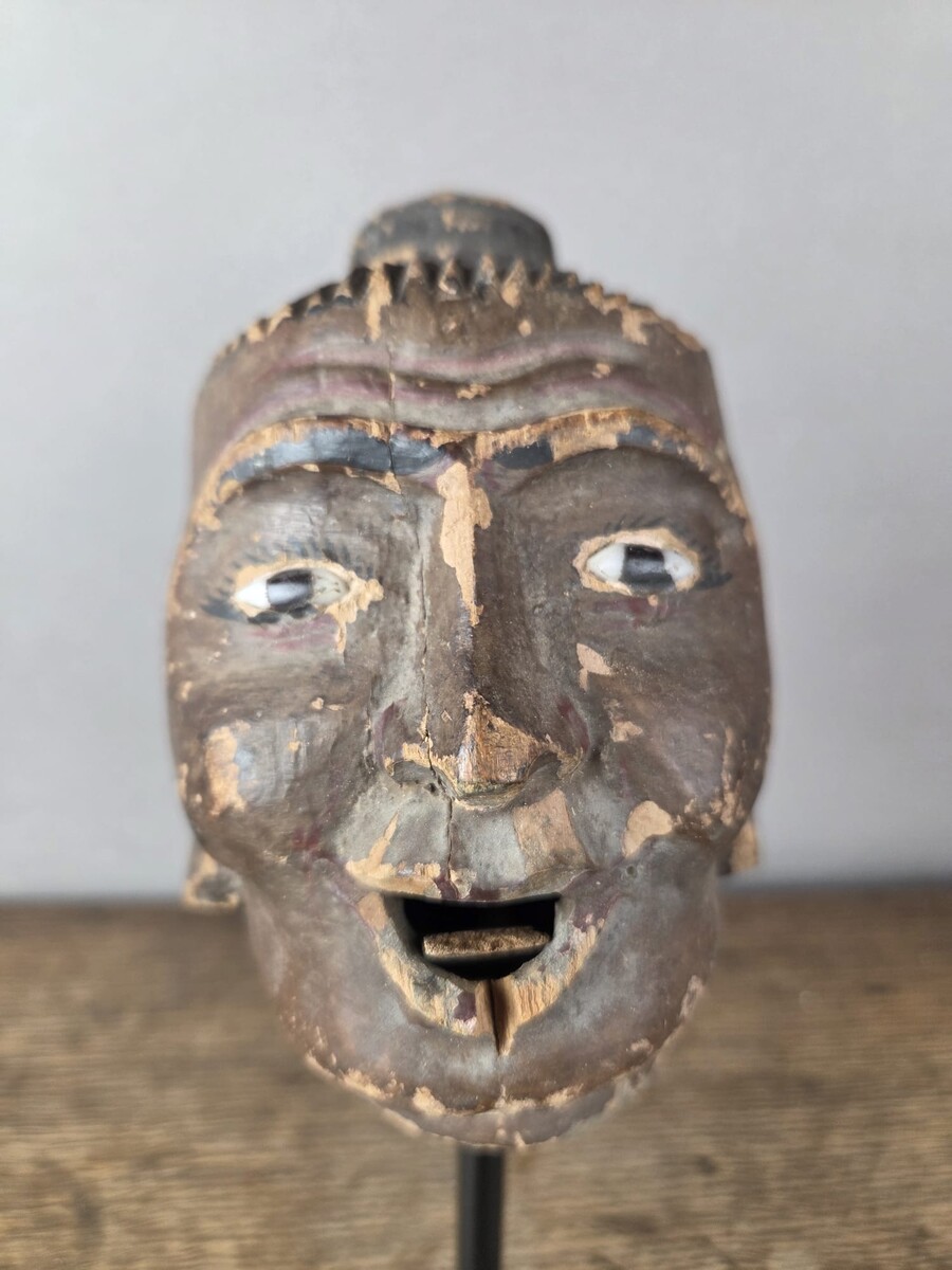 Two carved wooden puppet heads on a base, Burma, late 19th century