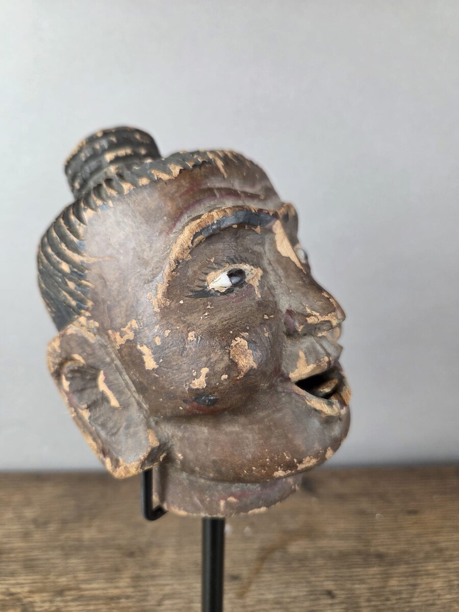 Two carved wooden puppet heads on a base, Burma, late 19th century