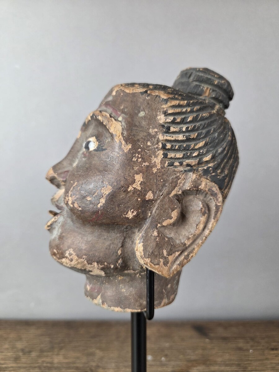 Two carved wooden puppet heads on a base, Burma, late 19th century