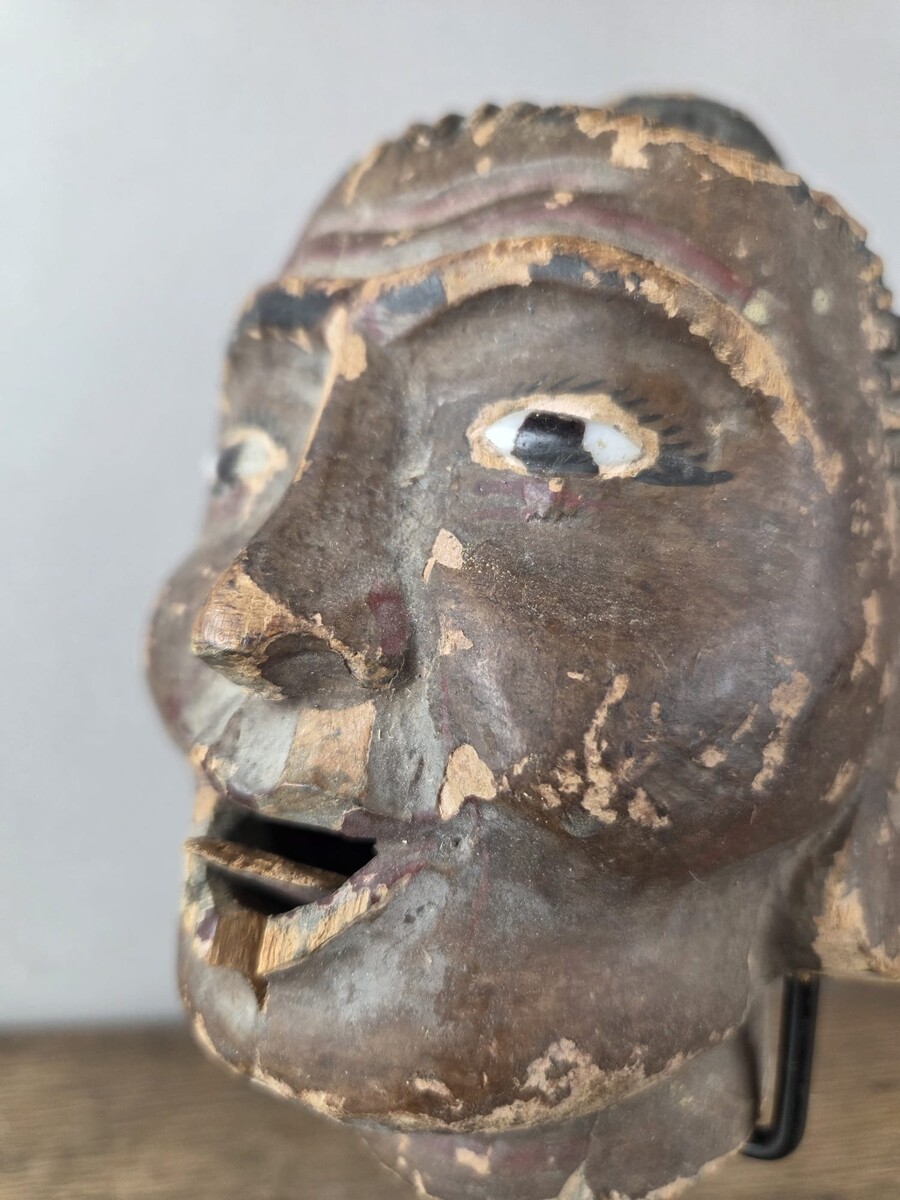 Two carved wooden puppet heads on a base, Burma, late 19th century