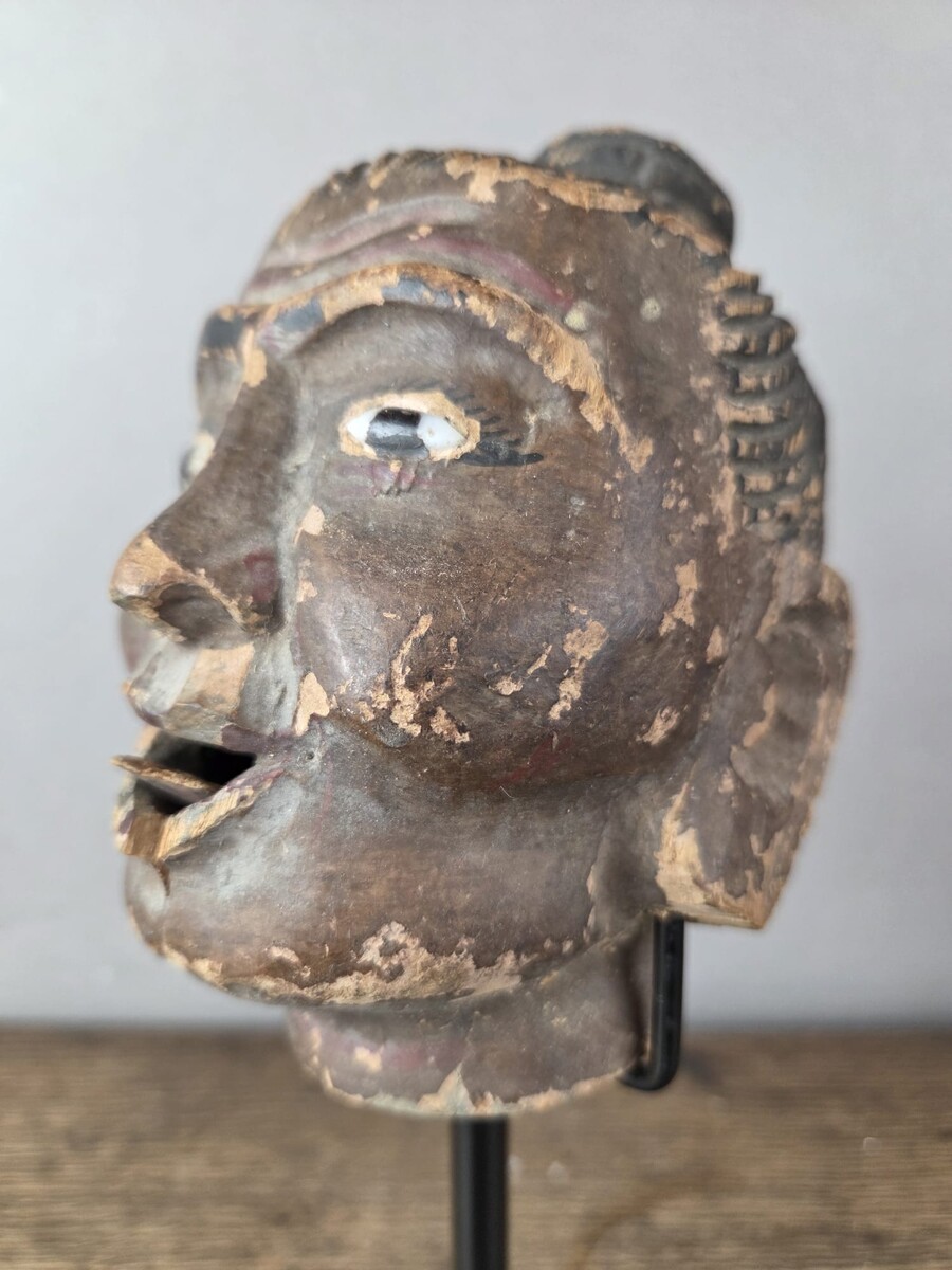 Two carved wooden puppet heads on a base, Burma, late 19th century