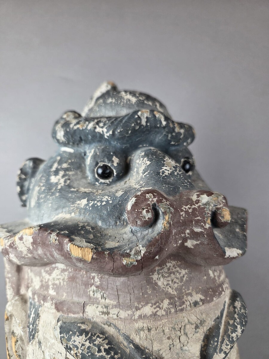 Wooden head on a base, representing a temple guardian, China, late 19th century