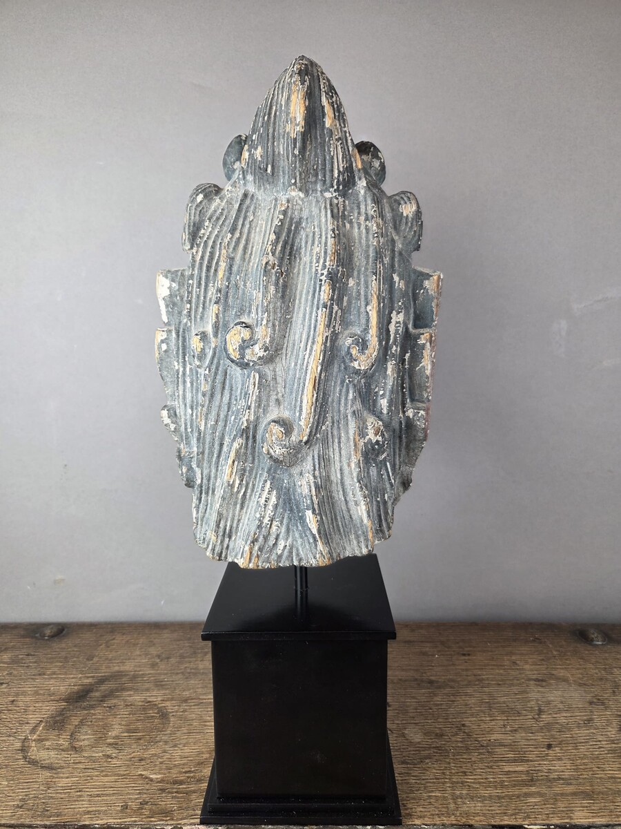 Wooden head on a base, representing a temple guardian, China, late 19th century