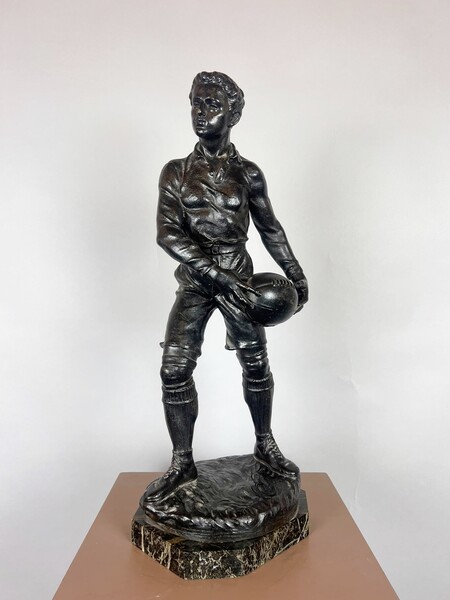 Zamak sculpture depicting The Rugby Player, signed by G. Demange.
