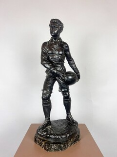 Zamak sculpture depicting The Rugby Player, signed by G. Demange.