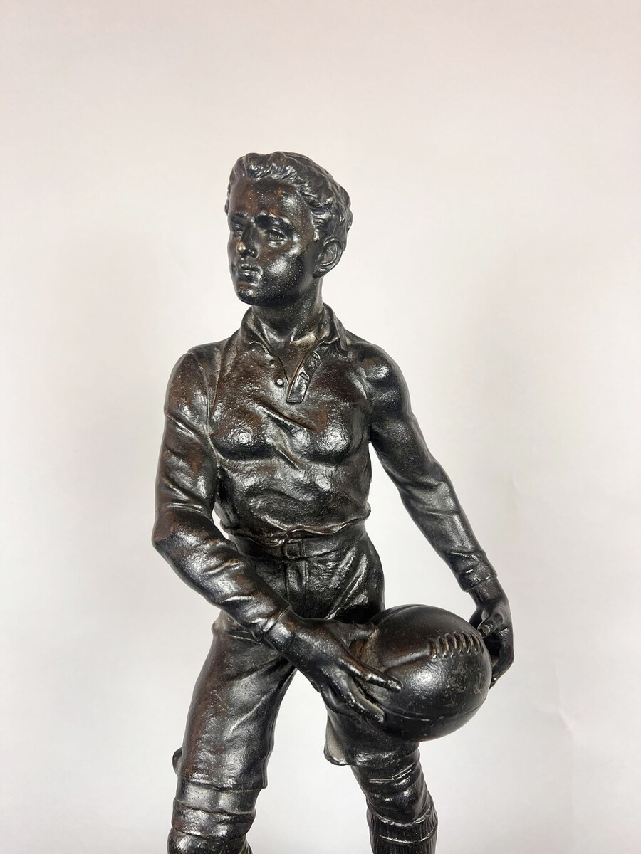Zamak sculpture depicting The Rugby Player, signed by G. Demange.