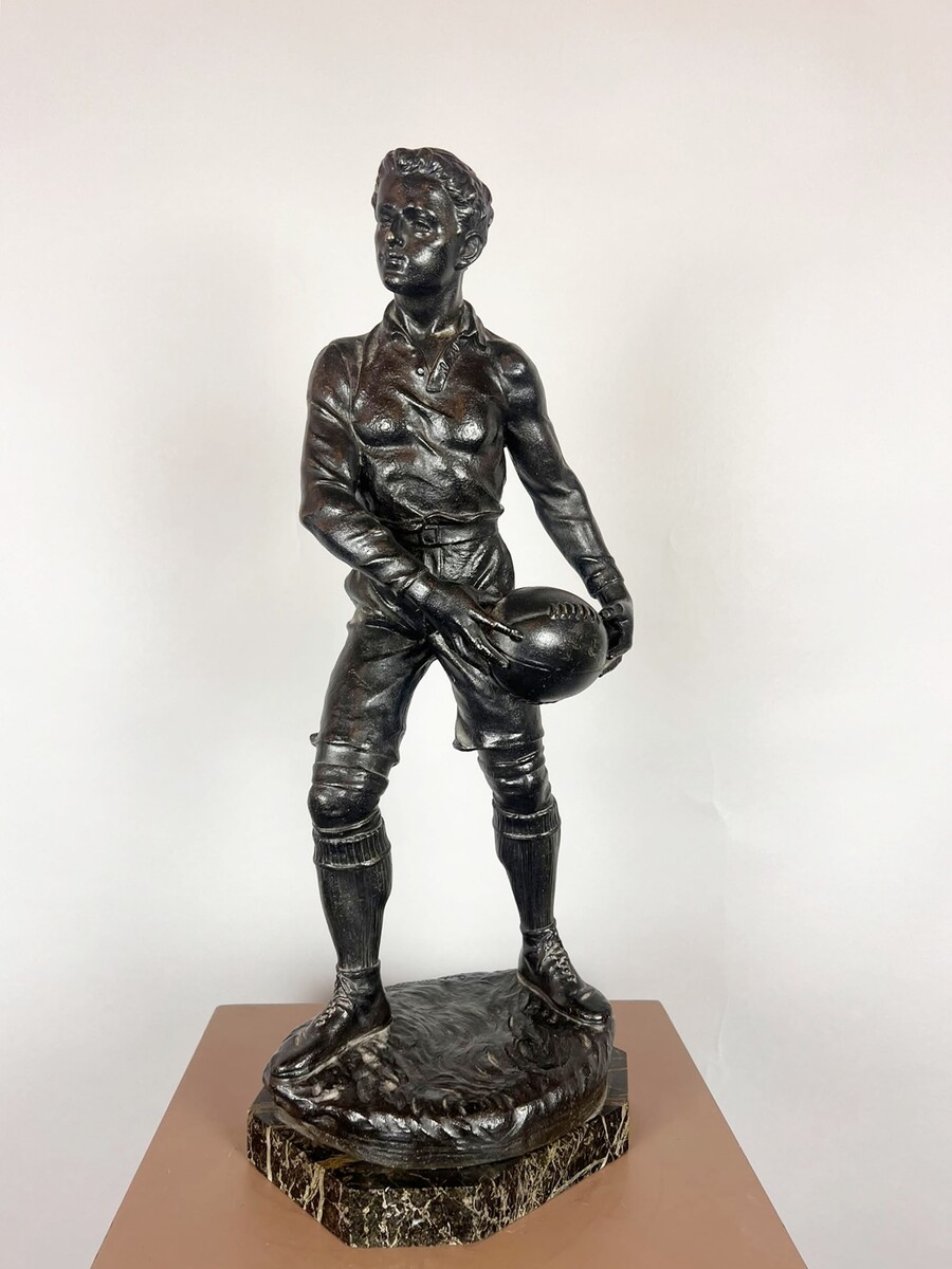 Zamak sculpture depicting The Rugby Player, signed by G. Demange.
