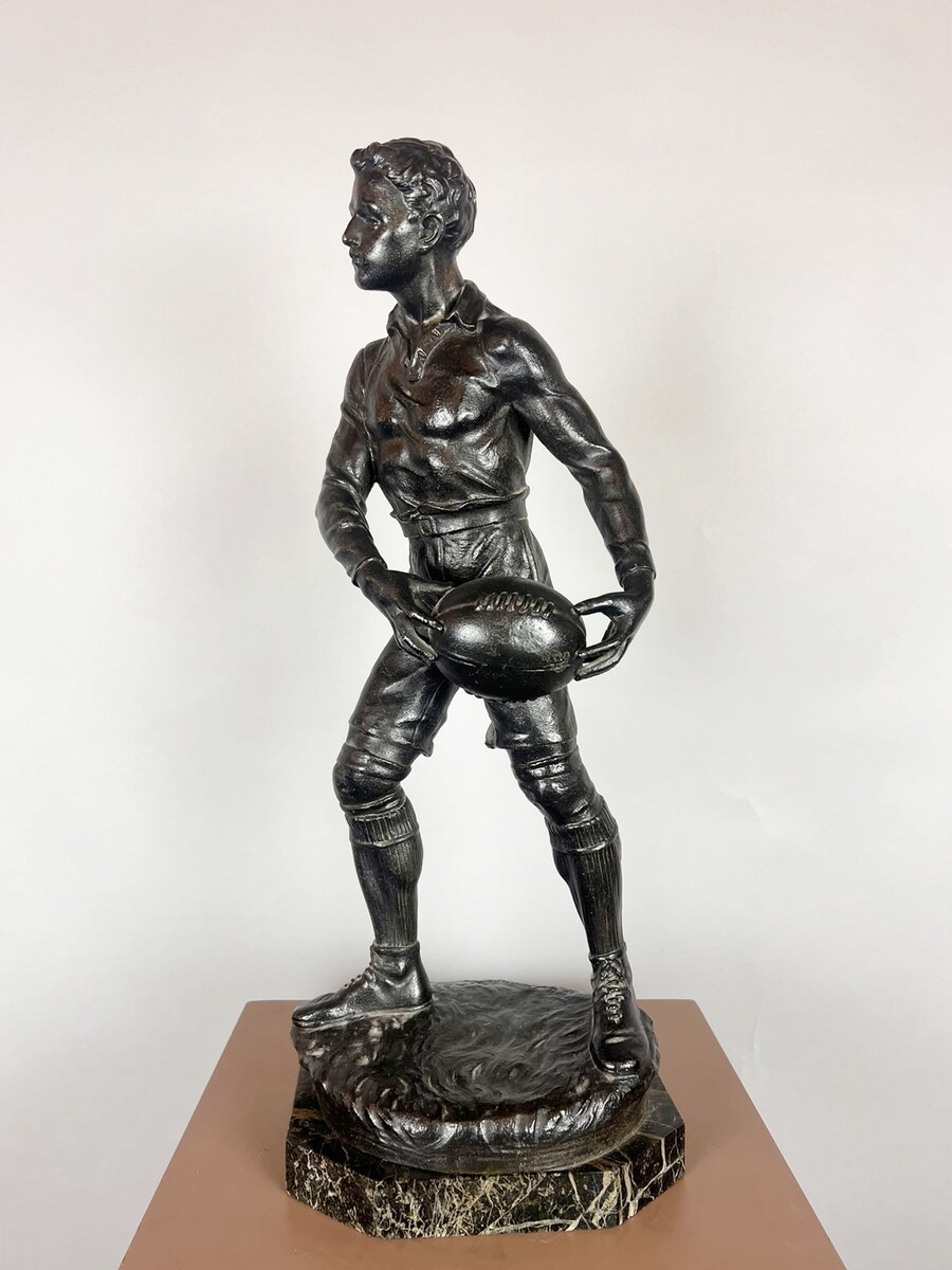 Zamak sculpture depicting The Rugby Player, signed by G. Demange.