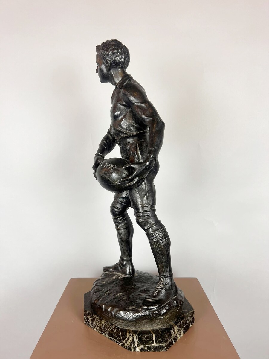 Zamak sculpture depicting The Rugby Player, signed by G. Demange.