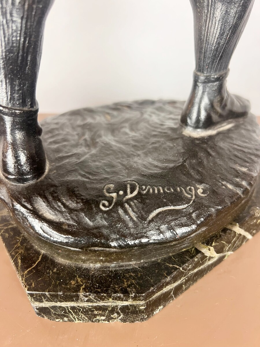 Zamak sculpture depicting The Rugby Player, signed by G. Demange.