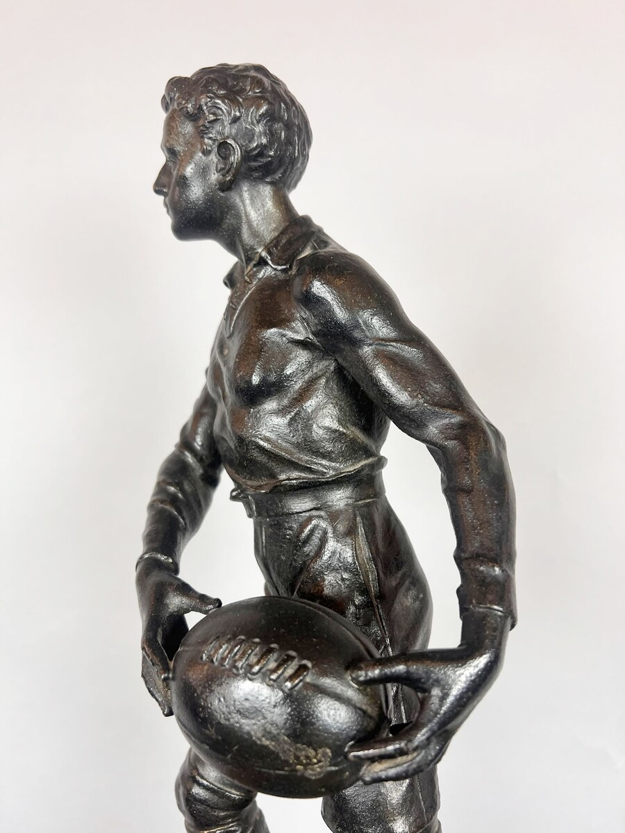 Zamak sculpture depicting The Rugby Player, signed by G. Demange.